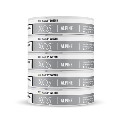 Stack of XQS Alpine nicotine pouches on a white background
